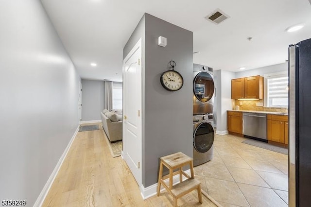 29 E Price St Unit 2, Linden City, NJ 07036 - corridor with stacked washer / dryer, baseboards, plenty of natural light, and recessed lighting