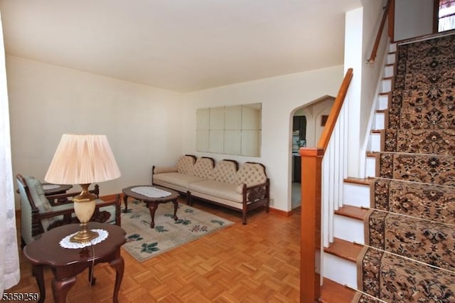 15 Garwood Ct N, Garfield City, NJ 07026 - living room featuring arched walkways and stairway