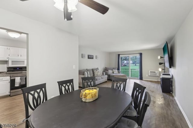 798 Eves Dr Unit 3G, Hillsborough Twp, NJ 08844 - dining area featuring light wood-style floors, a ceiling fan, baseboards, and a wall unit AC