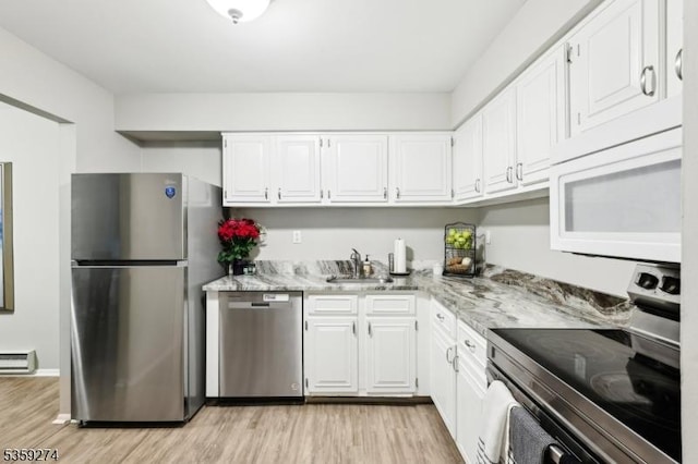 798 Eves Dr Unit 3G, Hillsborough Twp, NJ 08844 - kitchen with stainless steel appliances, light wood-style floors, white cabinets, and a baseboard heating unit