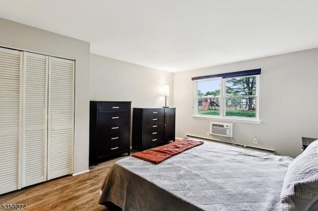 798 Eves Dr Unit 3G, Hillsborough Twp, NJ 08844 - bedroom with light wood-type flooring, a closet, and a wall unit AC