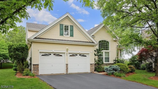 37 Hancock Pl, Franklin Twp, NJ 08873 - traditional-style house with driveway, stone siding, a garage, and a front lawn