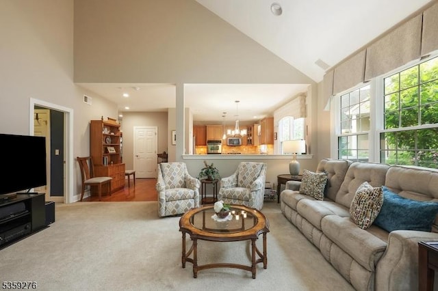 37 Hancock Pl, Franklin Twp, NJ 08873 - living area featuring high vaulted ceiling, a chandelier, and light carpet