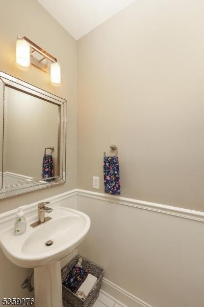37 Hancock Pl, Franklin Twp, NJ 08873 - bathroom with a sink and baseboards