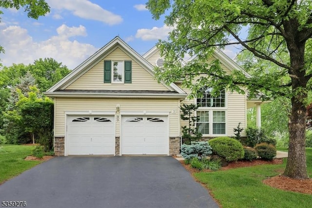 37 Hancock Pl, Franklin Twp, NJ 08873 - view of front facade with asphalt driveway and stone siding