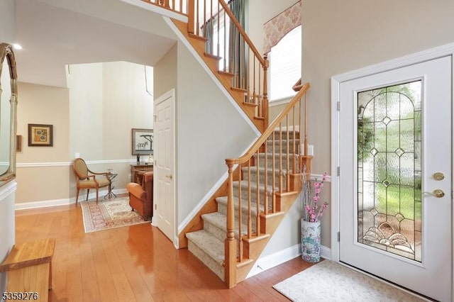 37 Hancock Pl, Franklin Twp, NJ 08873 - entrance foyer featuring wood-type flooring, stairs, baseboards, and a high ceiling