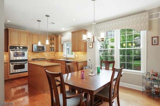 37 Hancock Pl, Franklin Twp, NJ 08873 - dining area featuring light wood-style flooring, healthy amount of natural light, a chandelier, recessed lighting, and baseboards