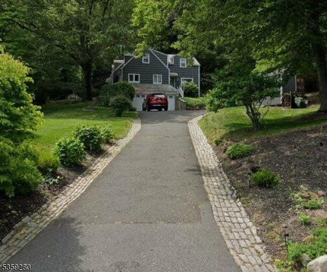 359 Dogwood Way, Mountainside Boro, NJ 07092 - view of grassy yard featuring asphalt driveway and an attached garage
