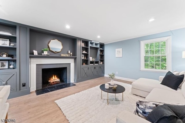 359 Dogwood Way, Mountainside Boro, NJ 07092 - living area with wood finished floors, a brick fireplace, recessed lighting, built in features, and baseboards