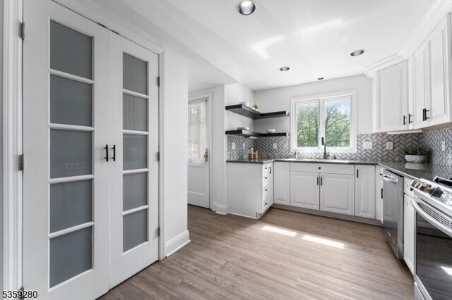 359 Dogwood Way, Mountainside Boro, NJ 07092 - kitchen featuring stainless steel appliances, a sink, white cabinetry, backsplash, and open shelves