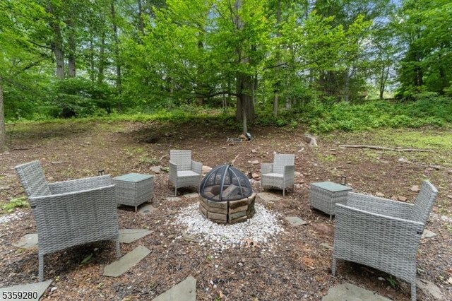 359 Dogwood Way, Mountainside Boro, NJ 07092 - view of patio / terrace with an outdoor fire pit