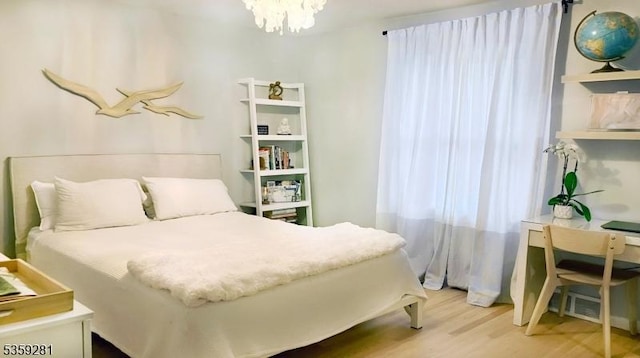 7 Park Dr, Kenilworth Boro, NJ 07033 - bedroom with wood finished floors and a chandelier