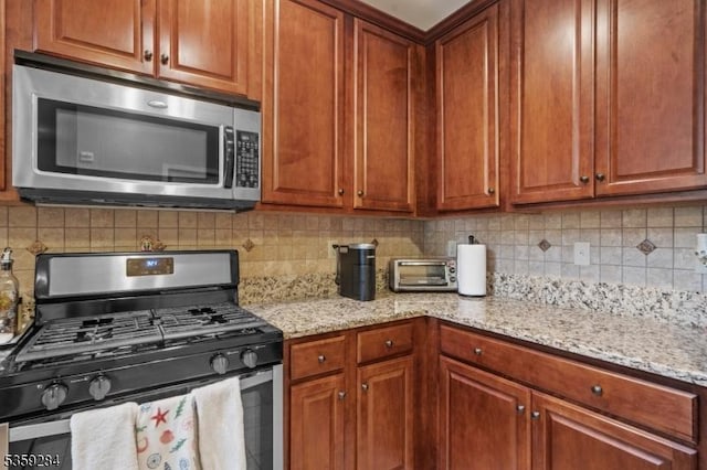 6406 Brookhaven Ct, Riverdale Boro, NJ 07457 - kitchen featuring stainless steel appliances, light stone counters, and tasteful backsplash