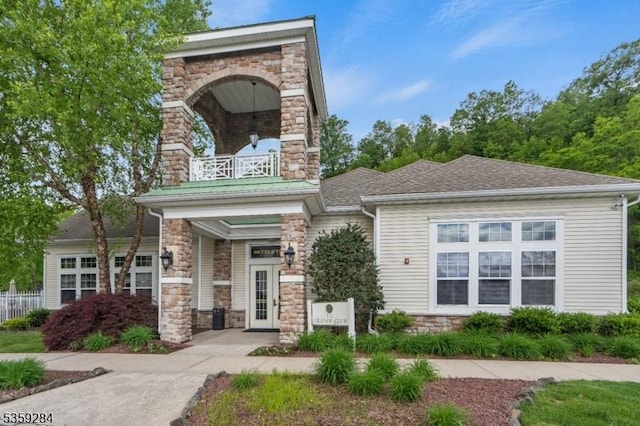 6406 Brookhaven Ct, Riverdale Boro, NJ 07457 - view of front of home with stone siding, a balcony, and a chimney