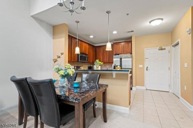 6406 Brookhaven Ct, Riverdale Boro, NJ 07457 - dining space featuring a chandelier, baseboards, light tile patterned floors, and recessed lighting