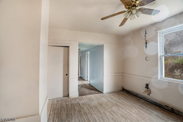615 S New York Rd, Galloway Twp, NJ 08205 - empty room with a ceiling fan, healthy amount of natural light, and wood finished floors