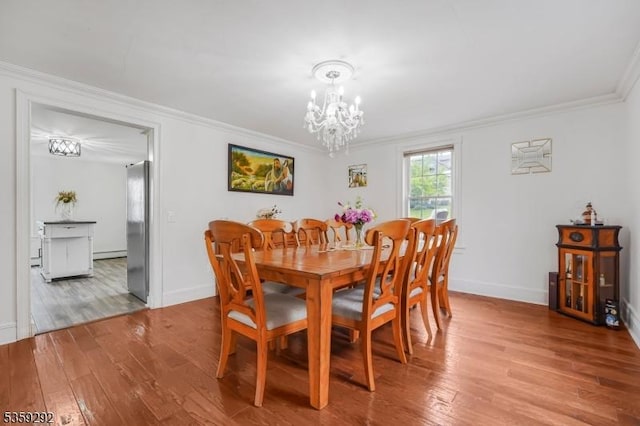 6 Highland Ave, Montville Twp, NJ 07045 - dining room with a chandelier, wood finished floors, crown molding, and baseboards