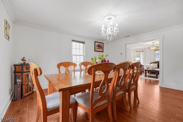 6 Highland Ave, Montville Twp, NJ 07045 - dining area with ornamental molding, a chandelier, wood finished floors, and baseboards