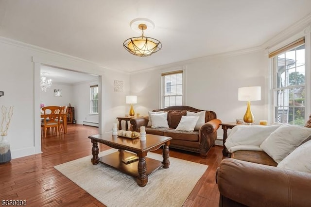 6 Highland Ave, Montville Twp, NJ 07045 - living area featuring ornamental molding, wood finished floors, a baseboard heating unit, a chandelier, and baseboards