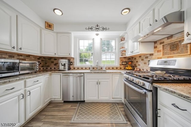 6 Highland Ave, Montville Twp, NJ 07045 - kitchen with appliances with stainless steel finishes, under cabinet range hood, a sink, and white cabinets