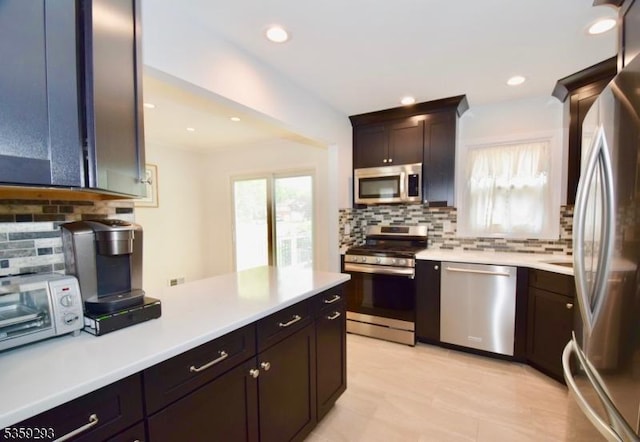 99 Mapes Ave, Springfield Twp, NJ 07081 - kitchen featuring stainless steel appliances, backsplash, healthy amount of natural light, and recessed lighting