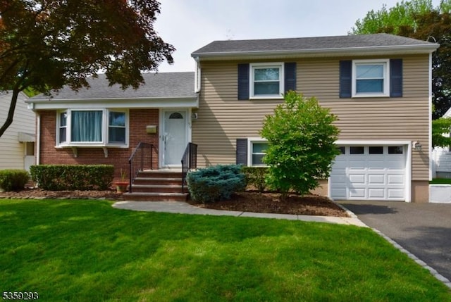 99 Mapes Ave, Springfield Twp, NJ 07081 - split level home featuring a garage, a front yard, and asphalt driveway