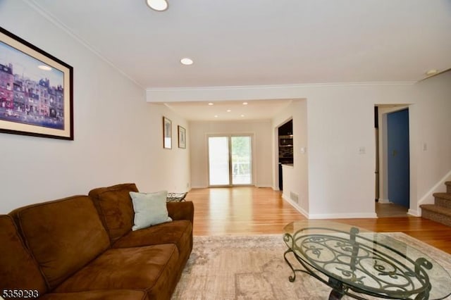 99 Mapes Ave, Springfield Twp, NJ 07081 - living area featuring light wood finished floors, stairway, ornamental molding, and recessed lighting
