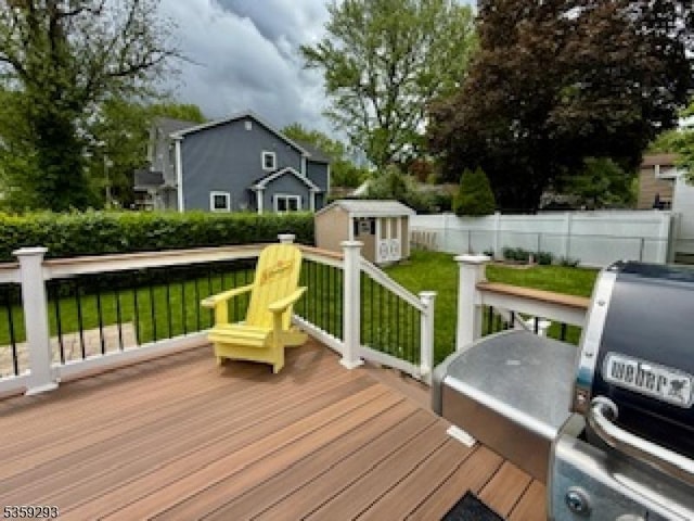 99 Mapes Ave, Springfield Twp, NJ 07081 - wooden terrace featuring a shed