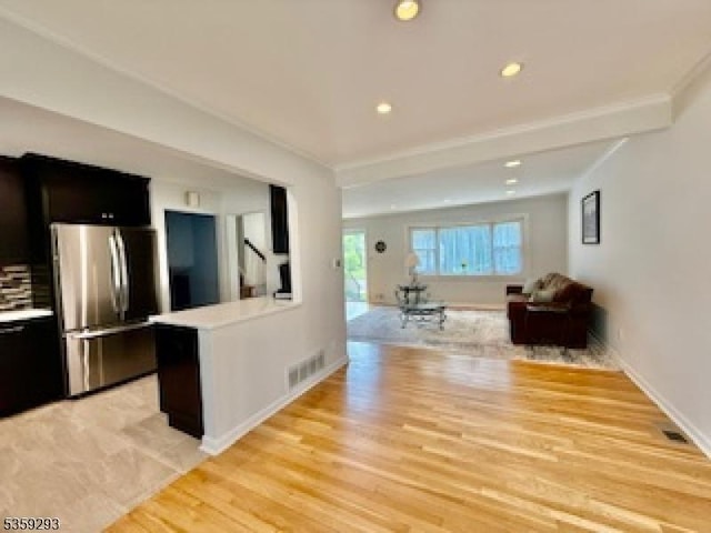 99 Mapes Ave, Springfield Twp, NJ 07081 - living area with light wood-style floors, recessed lighting, and crown molding