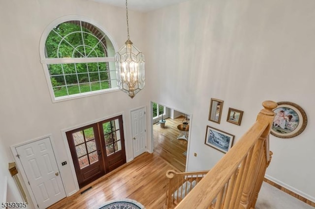 785 Backhus Estate Rd, Lebanon Twp, NJ 08826 - entryway featuring a chandelier, a high ceiling, wood finished floors, french doors, and baseboards
