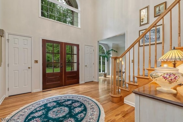 785 Backhus Estate Rd, Lebanon Twp, NJ 08826 - foyer featuring healthy amount of natural light, wood finished floors, stairway, and a high ceiling