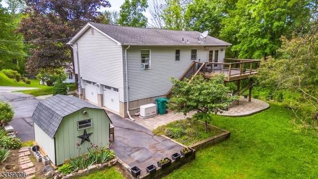 6 Gardenia Rd, Vernon Twp, NJ 07418 - back of house featuring a deck, an attached garage, a lawn, and driveway