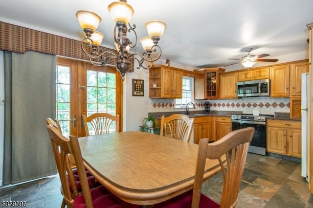 6 Gardenia Rd, Vernon Twp, NJ 07418 - dining area featuring a chandelier, dark stone finish flooring, and ceiling fan