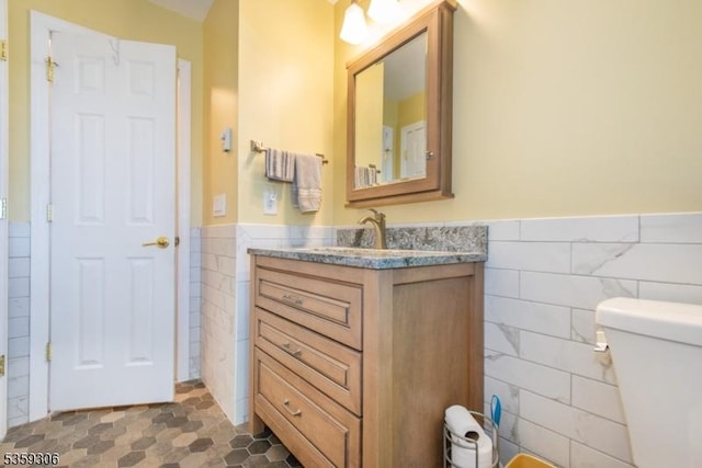 6 Gardenia Rd, Vernon Twp, NJ 07418 - bathroom featuring tile walls, a wainscoted wall, vanity, and toilet