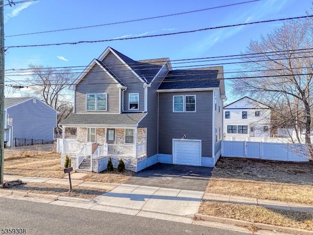 230 Park Ave, Piscataway Twp, NJ 08854 - view of front of house with covered porch, driveway, and a garage