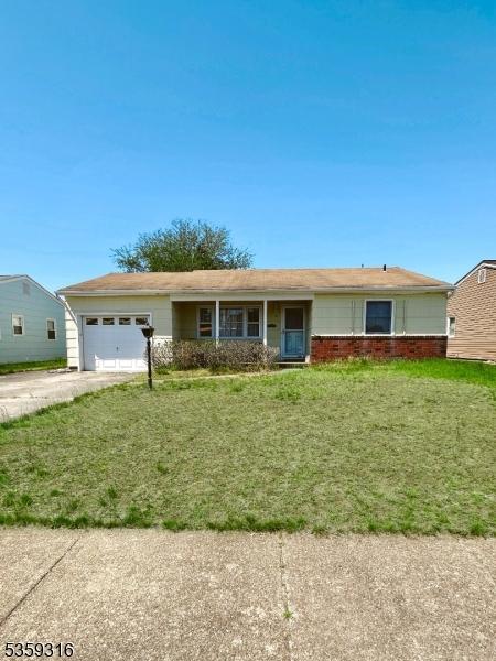 6 Langley Rd, Berkeley Twp, NJ 08757 - single story home with driveway, an attached garage, and a front lawn