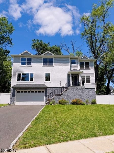 190 Riverside Dr, Springfield Twp, NJ 07081 - view of front of house with a garage, asphalt driveway, and stairway
