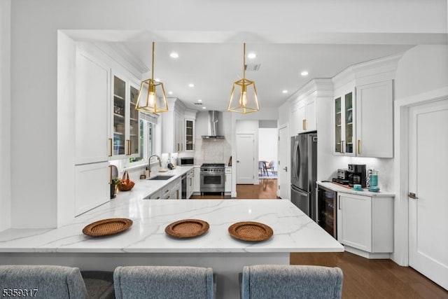190 Riverside Dr, Springfield Twp, NJ 07081 - kitchen featuring appliances with stainless steel finishes, a sink, wall chimney exhaust hood, beverage cooler, and recessed lighting