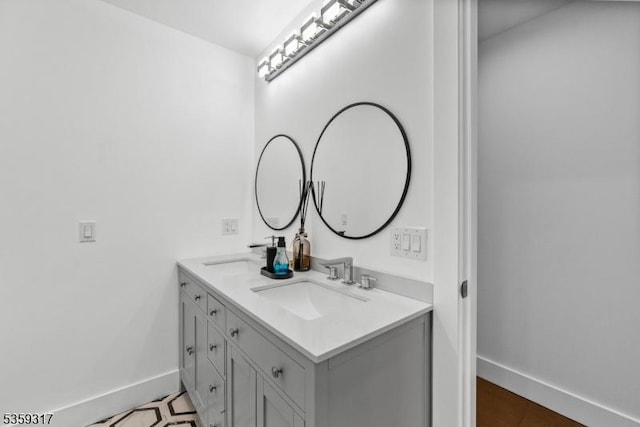190 Riverside Dr, Springfield Twp, NJ 07081 - bathroom featuring baseboards and double vanity