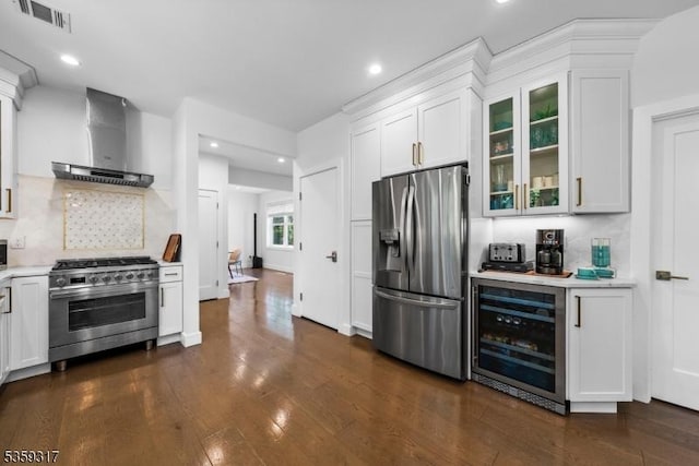 190 Riverside Dr, Springfield Twp, NJ 07081 - kitchen featuring stainless steel appliances, wall chimney range hood, beverage cooler, light countertops, and white cabinets