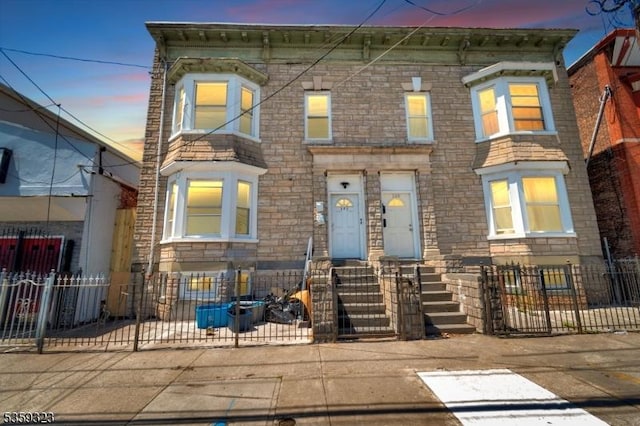171 Sherman Ave, Newark City, NJ 07114 - view of front of house featuring a fenced front yard and stone siding