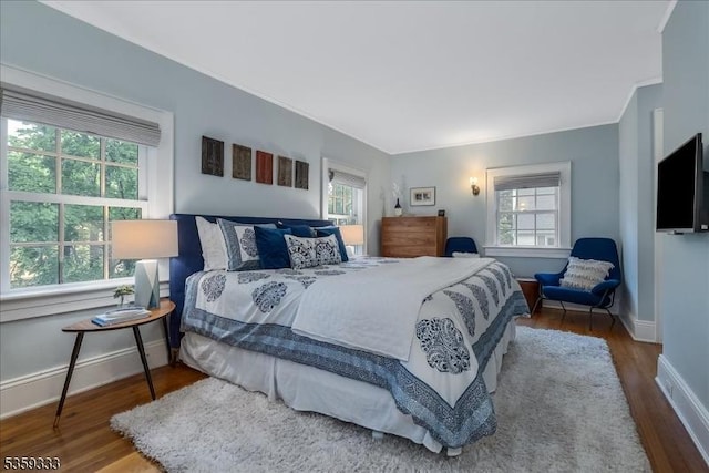 48 Baltusrol Way, Millburn Twp, NJ 07078 - bedroom with multiple windows, wood finished floors, baseboards, and crown molding