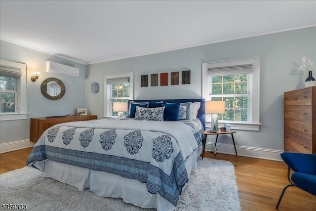48 Baltusrol Way, Millburn Twp, NJ 07078 - bedroom with a wall unit AC, ornamental molding, multiple windows, wood finished floors, and baseboards