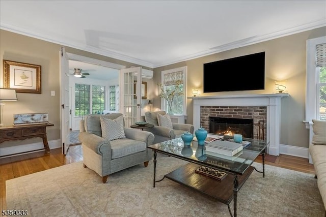 48 Baltusrol Way, Millburn Twp, NJ 07078 - living room with crown molding, ceiling fan, wood finished floors, a brick fireplace, and baseboards