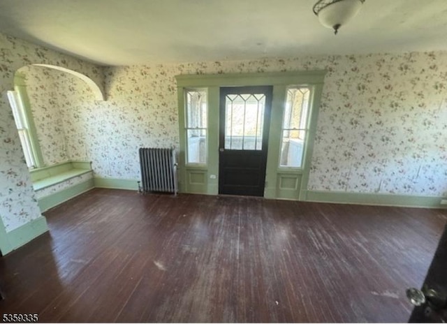 25 Prospect Ave, Andover Boro, NJ 07821 - entrance foyer with radiator heating unit, wood finished floors, wallpapered walls, and baseboards