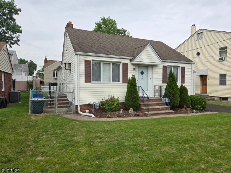 131 Palsa Ave, Elmwood Park Boro, NJ 07407 - bungalow-style home featuring a front yard, central AC unit, a chimney, and a shingled roof