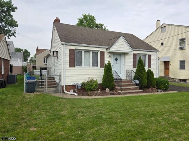 131 Palsa Ave, Elmwood Park Boro, NJ 07407 - bungalow-style home featuring a front yard, central AC unit, a chimney, and a shingled roof