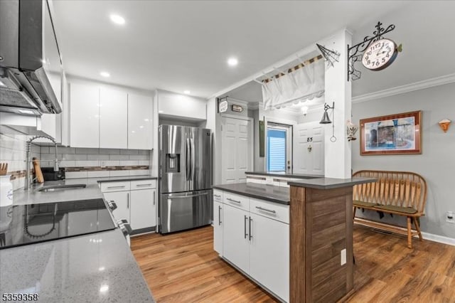 85 Smithfield Ct, Bernards Twp, NJ 07920 - kitchen with stainless steel fridge, a sink, ornamental molding, white cabinetry, and decorative backsplash