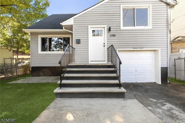 1190 Union St, Linden City, NJ 07036 - view of front facade featuring a garage, driveway, and a shingled roof