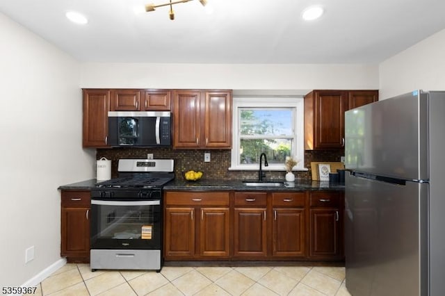 1190 Union St, Linden City, NJ 07036 - kitchen featuring stainless steel appliances, a sink, decorative backsplash, light tile patterned floors, and recessed lighting